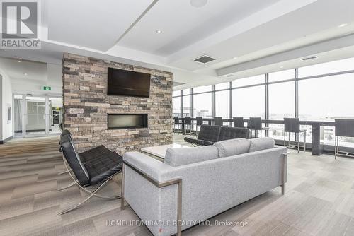 T1-1901 - 330 Phillip Street S, Waterloo, ON - Indoor Photo Showing Living Room With Fireplace