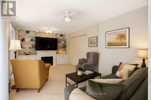 Digitally staged - Family room - 735 Niagara Boulevard, Fort Erie (Central), ON - Indoor Photo Showing Living Room With Fireplace