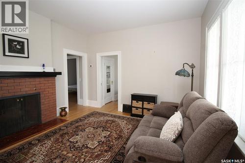 671 2Nd Street E, Shaunavon, SK - Indoor Photo Showing Living Room With Fireplace