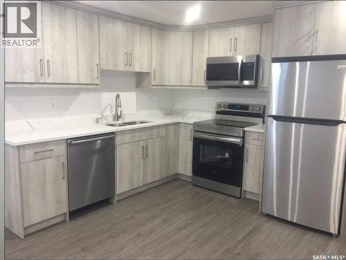 144 Forsey Avenue, Saskatoon, SK - Indoor Photo Showing Kitchen With Double Sink