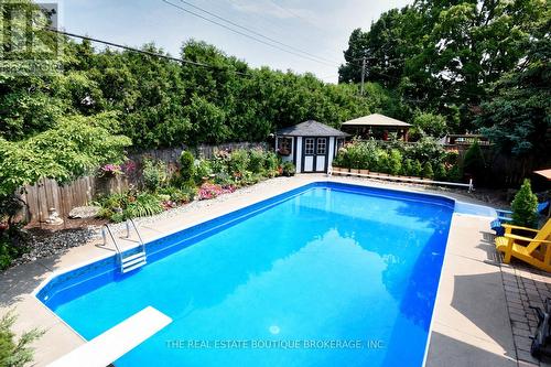 Backyard Oasis featuring gorgeous gardens - 4131 Lorraine Crescent, Burlington, ON - Outdoor With In Ground Pool With Deck Patio Veranda With Backyard