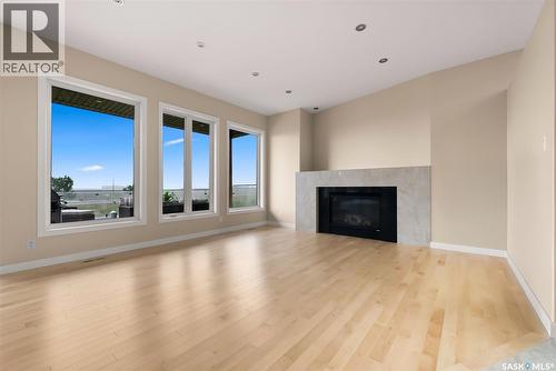 6110 Wascana Court, Regina, SK - Indoor Photo Showing Living Room With Fireplace