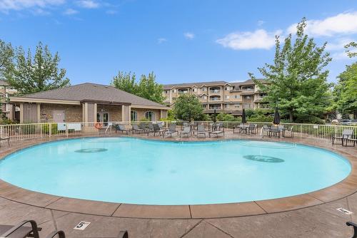 113-1962 Enterprise Way, Kelowna, BC - Outdoor With In Ground Pool With Backyard