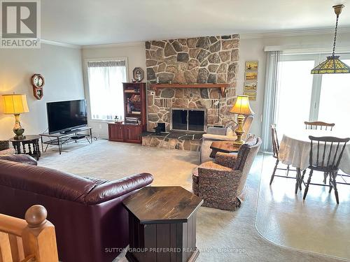 174 Quarter Town Line, Tillsonburg, ON - Indoor Photo Showing Living Room With Fireplace