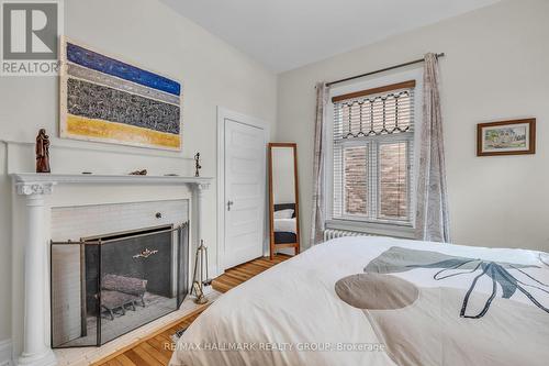 with wood burning fire place - 396 Daly Avenue, Ottawa, ON - Indoor Photo Showing Bedroom