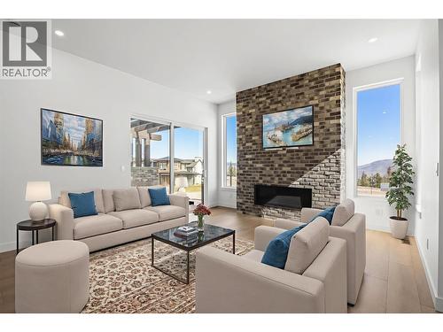 This photo was virtually staged. - 1298 Brechin Place, Kamloops, BC - Indoor Photo Showing Living Room With Fireplace