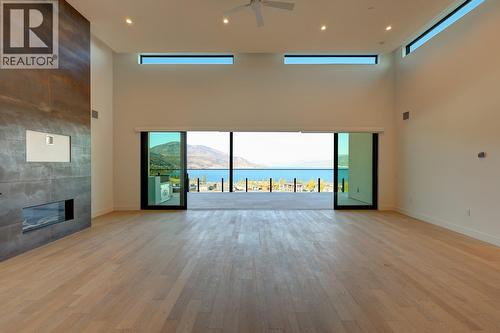 3000 Ariva Drive Unit# 3503, Kelowna, BC - Indoor Photo Showing Other Room With Fireplace