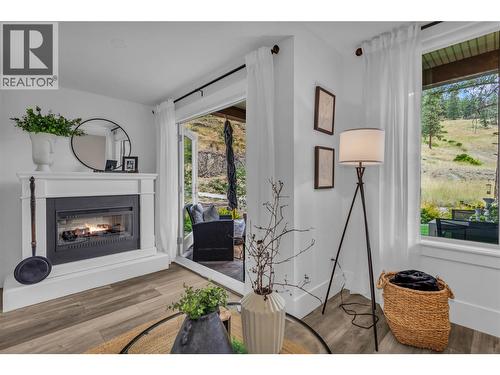 163-4000 Trails Place, Peachland, BC - Indoor Photo Showing Living Room With Fireplace
