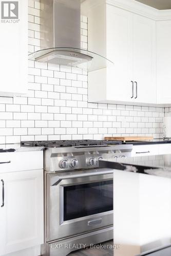 6 burner 36 inch Kitchen Aid Stove - 83 Essex Drive N, Belleville (Thurlow Ward), ON - Indoor Photo Showing Kitchen With Upgraded Kitchen