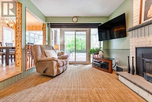 690 Robertson Crescent, Milton (Tm Timberlea), ON - Indoor Photo Showing Living Room With Fireplace