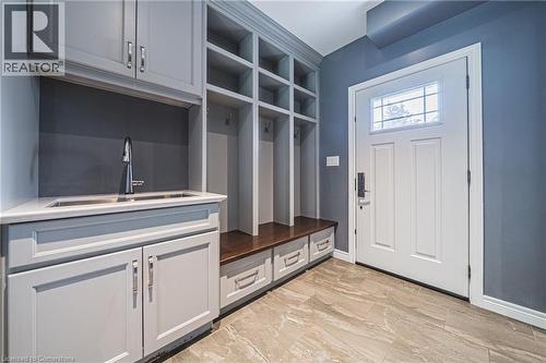 Mudroom featuring a sink and light marble finish flooring - 25 Orchard Hill, Hamilton, ON - Indoor