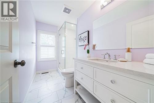 Bathroom featuring vanity, a stall shower, and marble look tiles - 25 Orchard Hill, Hamilton, ON - Indoor Photo Showing Bathroom