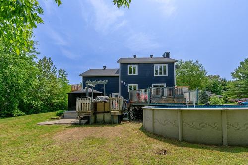 Back facade - 202 25E Rue O., Venise-En-Québec, QC - Outdoor With Above Ground Pool With Backyard