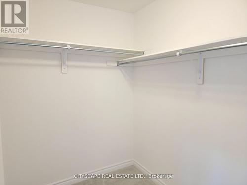 Primary Bedroom Walk-In Closet - 7 Fennell Street, Southgate, ON - Indoor With Storage