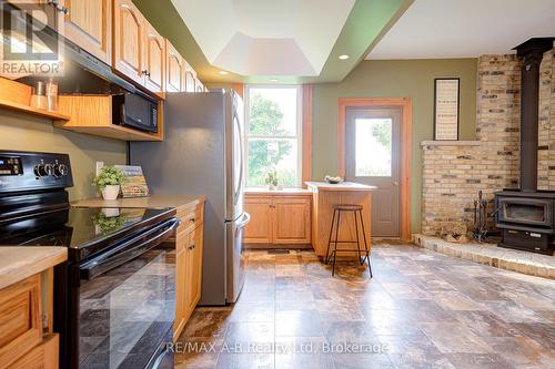 6355 Perth Rd 55 Line, West Perth (Logan), ON - Indoor Photo Showing Kitchen With Fireplace