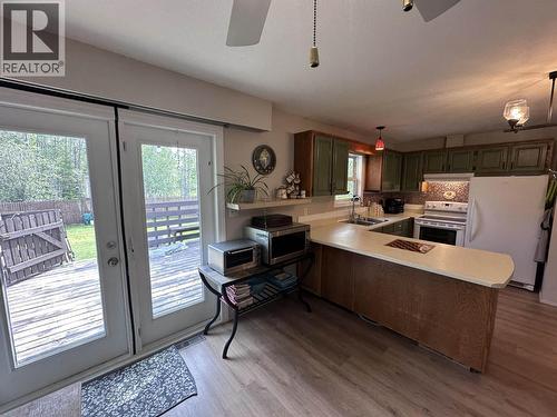 5216 Tamarack Crescent, Fort Nelson, BC - Indoor Photo Showing Kitchen With Double Sink