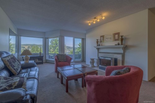 104-2560 Departure Bay Rd, Nanaimo, BC - Indoor Photo Showing Living Room With Fireplace