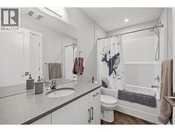 Main bathroom, cheater door to second bedroom - 