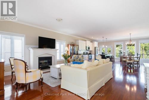 Open floor plan living room with gas fireplace - 77 Findlay Drive, Collingwood, ON - Indoor Photo Showing Living Room With Fireplace