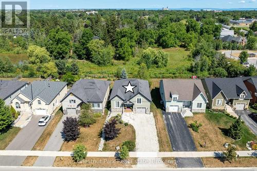 Aerial view of the home and greenspace - 77 Findlay Drive, Collingwood, ON - Outdoor With Facade With View
