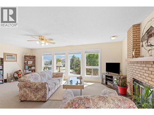 LIVING ROOM - Perfect for entertaining! - 3011 11 Street, Vernon, BC - Indoor Photo Showing Living Room With Fireplace