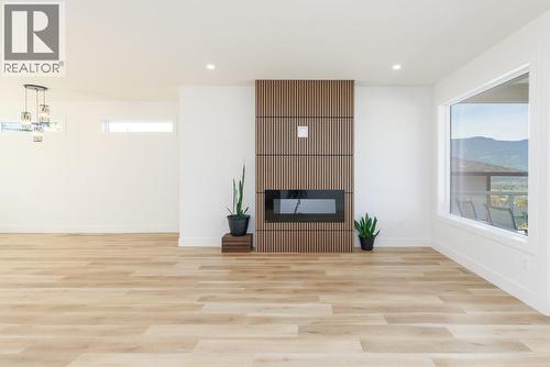 1160 16 Avenue Se, Salmon Arm, BC - Indoor Photo Showing Other Room With Fireplace
