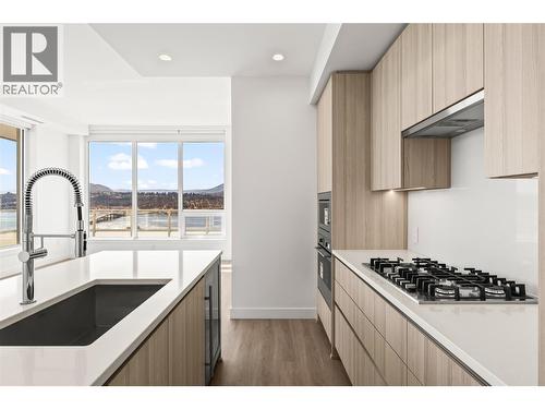 Kitchen and living space - 238 Leon Avenue Unit# 2107, Kelowna, BC - Indoor Photo Showing Kitchen With Upgraded Kitchen