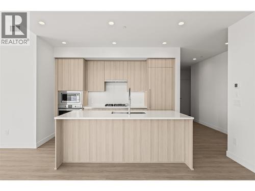 Modern kitchen with large island - 238 Leon Avenue Unit# 2107, Kelowna, BC - Indoor Photo Showing Kitchen