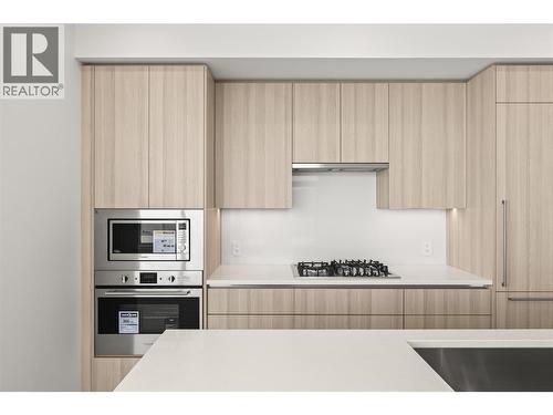 Wall oven, built-in microwave and gas range - 238 Leon Avenue Unit# 2107, Kelowna, BC - Indoor Photo Showing Kitchen