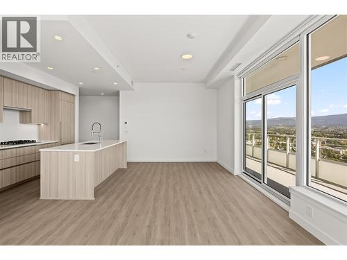 Living room with lake views and balcony access - 238 Leon Avenue Unit# 2107, Kelowna, BC - Indoor