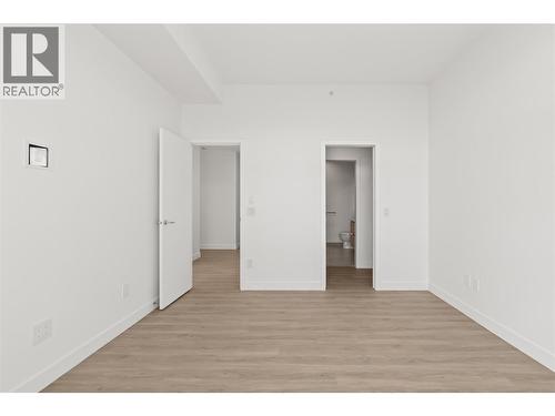Primary bedroom with balcony access - 238 Leon Avenue Unit# 2107, Kelowna, BC - Indoor Photo Showing Other Room