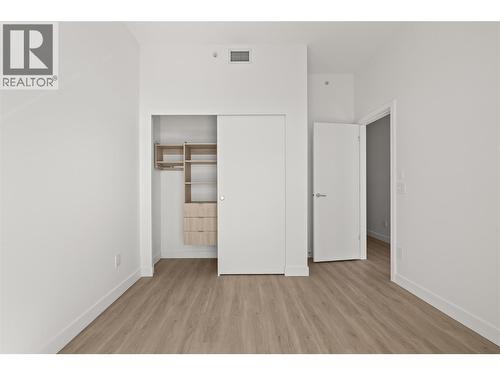 Second bedroom with private balcony access - 238 Leon Avenue Unit# 2107, Kelowna, BC - Indoor Photo Showing Other Room