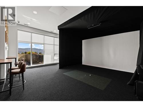 Amenities- golf simulator - 238 Leon Avenue Unit# 2107, Kelowna, BC - Indoor Photo Showing Other Room