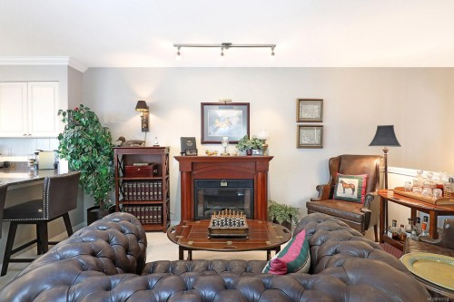 206-2275 Comox Ave, Comox, BC - Indoor Photo Showing Other Room With Fireplace