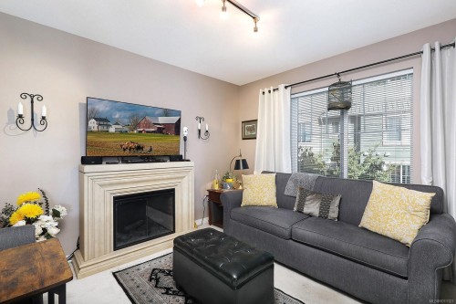206-2275 Comox Ave, Comox, BC - Indoor Photo Showing Living Room With Fireplace