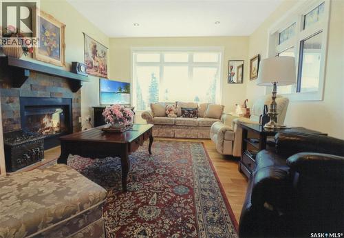 30 West Park Drive, Battleford, SK - Indoor Photo Showing Living Room With Fireplace