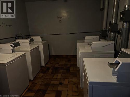Communal laundry room featuring washer and clothes dryer - 4 Avalon Place Unit# 102, Kitchener, ON - Indoor Photo Showing Laundry Room
