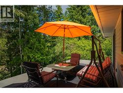 Patio in the main house that overlooks the river. - 