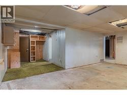 Unfinished basement of the brown house. - 