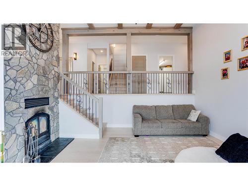 8792 Cortland Place, Coldstream, BC - Indoor Photo Showing Living Room With Fireplace