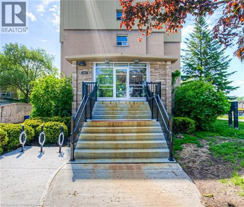 Doorway to property with stone siding - 283 Fairway Road N Unit# 501, Kitchener, ON - Outdoor