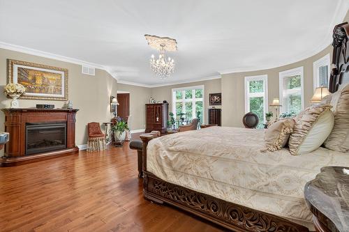 Chambre à coucher principale - 90 Ch. Des Renards, Rigaud, QC - Indoor Photo Showing Bedroom With Fireplace