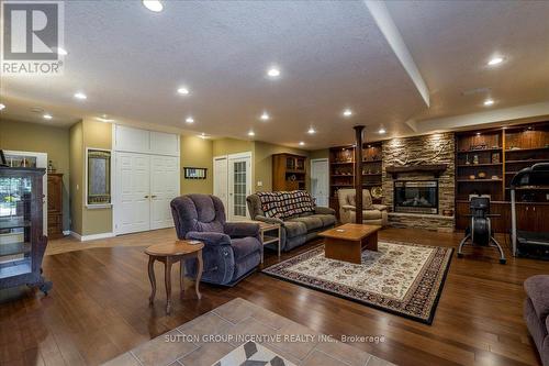 Basement Rec Room - 235 12 Line S, Oro-Medonte, ON - Indoor Photo Showing Living Room With Fireplace