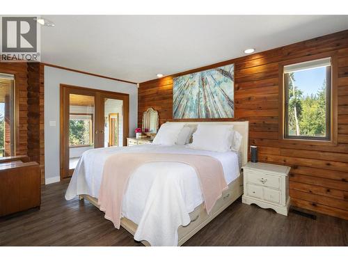 Primary Bedroom with Sunroom/Yoga Room and Access to Balcony - 7940 Keddleston Road, Vernon, BC 