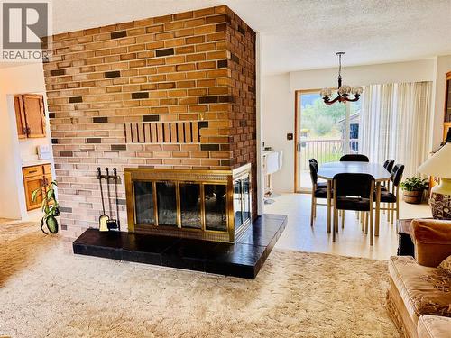 1270 59 Avenue, Grand Forks, BC - Indoor Photo Showing Living Room With Fireplace