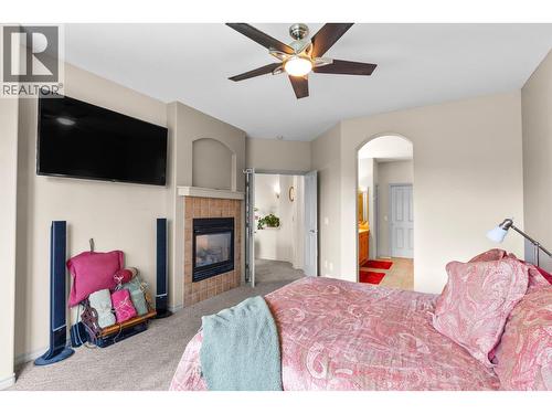 4520 Gallaghers Lookout Unit# 2, Kelowna, BC - Indoor Photo Showing Bedroom With Fireplace