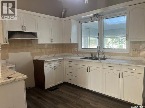 133 Halifax Street N, Regina, SK - Indoor Photo Showing Kitchen With Double Sink