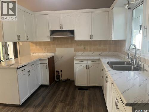 133 Halifax Street N, Regina, SK - Indoor Photo Showing Kitchen With Double Sink