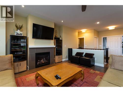833 Mccurdy Road E, Kelowna, BC - Indoor Photo Showing Living Room With Fireplace