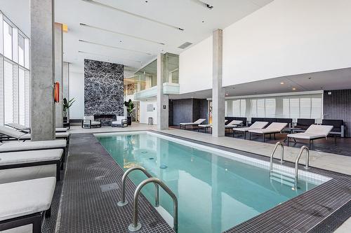 Pool - 305-360 Rue Atateken, Montréal (Ville-Marie), QC - Indoor Photo Showing Other Room With In Ground Pool